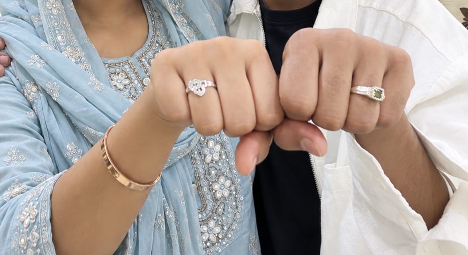 Ak and Nujhat showing their rings